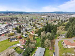 Drone view of property and surrounding area.