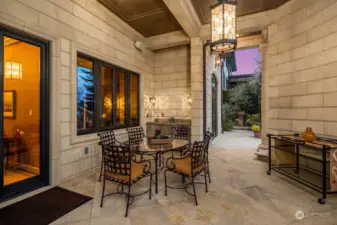 The Lower level patio space allows for large scale entertaining on the lake, featuring the finest in limestone tile and stone layout.