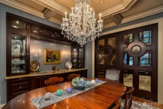 The formal Dining Room is the perfect place to host guests including a built-in buffet with walnut and marble finishes.