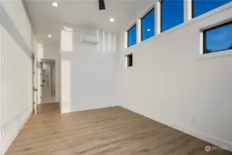 Walk in closet w/built in cabinets.