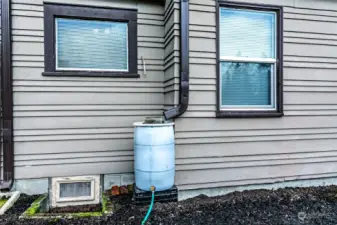 Rain barrels on front downspouts