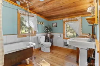 Spacious bathroom with claw-foot tub