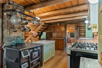 Vintage wood cookstove for ambiance--propane range for cooking.