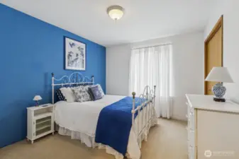 Ample sized second bedroom with a relaxing coastal-inspired ambiance.