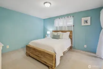Spacious and inviting, the Primary Bedroom blends cozy comfort with luxurious style.