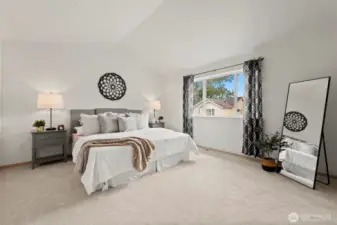 Master bedroom with vaulted ceiling