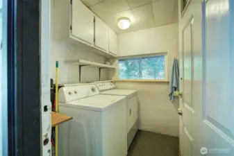 Laundry area is on the back porch of the house
