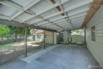 An additional carport adjoins the house and garage