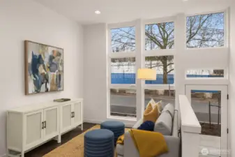 Livingroom features new window treatments and a minisplit for heating and cooling.