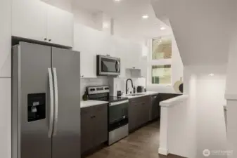 New stainless steel appliances and quartz countertops