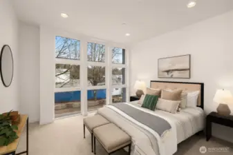Primary bedroom upstairs features a walk-in closet and an ensuite.