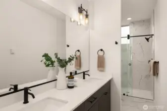 Ensuite bath includes a double sink vanity with a ceramic tile walk-in shower.