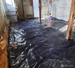 New vapor barrier in crawl space with 9 foot ceilings.