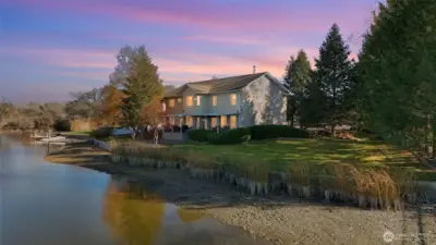 A view of the back of the home from the waterfront.