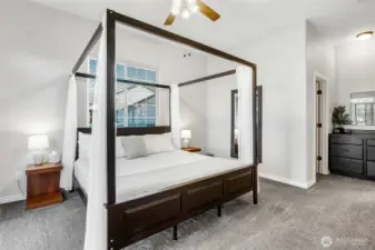 2nd Primary en suite on the main floor with huge walk in closet and a view of the lake. Access to the patio from the slider in the bedroom.