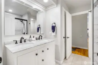 Downstairs UPDATED 3/4 bath off the 2nd primary suite. Heated floors