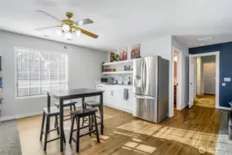 Wet bar with refrigerator that is included. New laminate flooring.