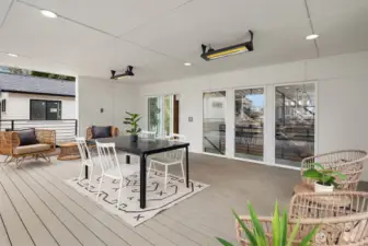 Large, covered, heated deck  *Photos are from 13546 featuring similar finishes and floor plan