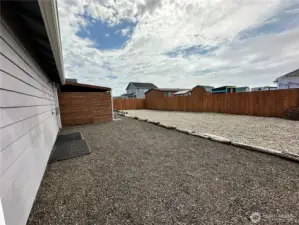 Large fenced landscaped back yard