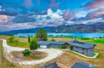Custom Northwest Mid-Century style home with panoramic Lake Osoyoos, mountain and territorial views