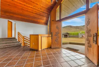 Enter through beautifully etched double front doors open to inviting and minimalist styled home entryway
