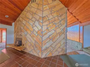 Entryway with floor-to-ceiling double fireplace