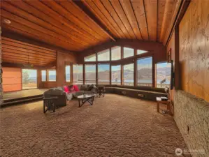 Living room to dining room view and a gorgeous etched artisan sliding interior wall panel opens to home office