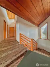 Stairwell to upper bedrooms, office and daylight basement