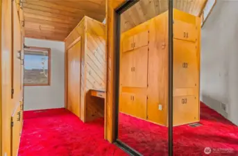 Primary Bedroom open walk-in closet and wall closet space providing ample clothing storage