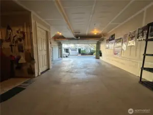 Garage view to street Work shop area and water tank to left