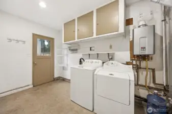 Tankless water heater for efficient comfort. Side exterior door offers easy access. Gas furnace. Washer & Dryer convey.