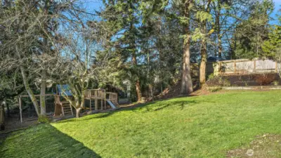 Park-like backyard with garden beds is ready for play!