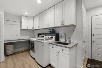 Remodeled laundry room: New tile, cabinets, counters, tile, washer & dryer + built-ins to the right for a convenient drop station/mud room.
