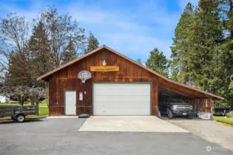 Awesome 28x40 shop with 16 ft wide by 9 ft high automatic garage door and lean to's off right side and back side of shop. So much storage space for all your toys!!! Lean-to's measure 15'x40' and 12'x30' (on the back side)
