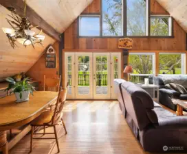 French doors lead out onto large deck overlooking front pasture