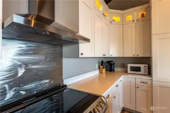 The swimming salmon on the backsplash at the cooktop is custom-made.