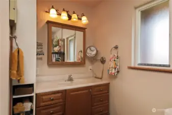 Full guest bath with wide doorway access.