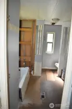 Master's bath missing flooring and bathtub not attached.