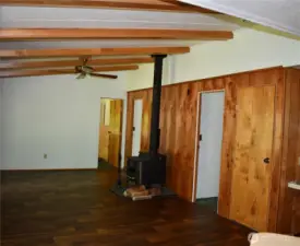 Family room with wood stove and access to all 3 bedrooms.