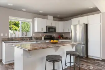 Guests can gather on stools in the kitchen to keep the chef entertained!