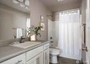 Full guest bathroom off the hallway.
