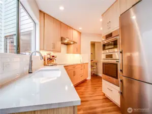 Recently updated kitchen with quartz countertops and upgraded stainless steel appliances