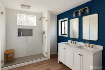 Remodeled upstairs bathroom with full tile walk-in shower and dual vanity.