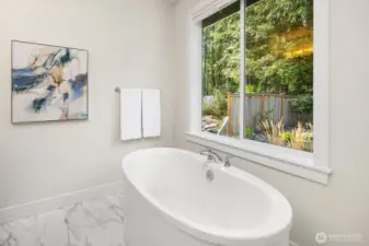 Soaking tub w/ greenbelt privacy
