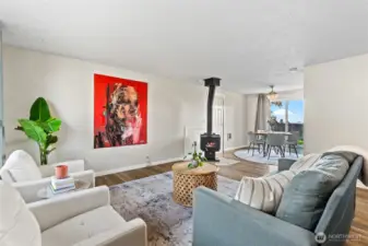 Lovely entry and main living area with cozy wood burning stove.
