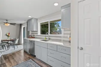 Hardtop countertops and a large window overlooking the backyard!
