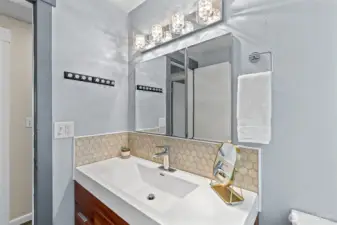 Fully updated bathroom down the hallway to the left.