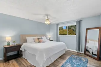 Spacious main bedroom located at the end of the hallway.