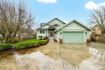 Plenty of guest parking - attached two car garage, plus ample space in the paved driveway.  Craftsman touches like the covered porch, shingles, and trim detail add to the charm of this great home.