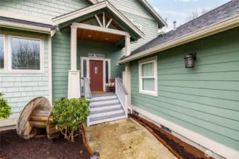 Front porch sittin'.  The covered porch is spacious enough for porch swing, and provides a gracious entry for guests.